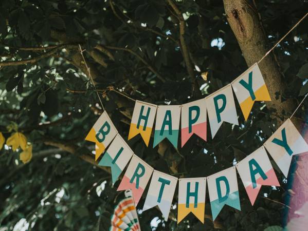 happy-birthday-banner-hangs-from-a-tree-royalty-free-image-1657296329(1)